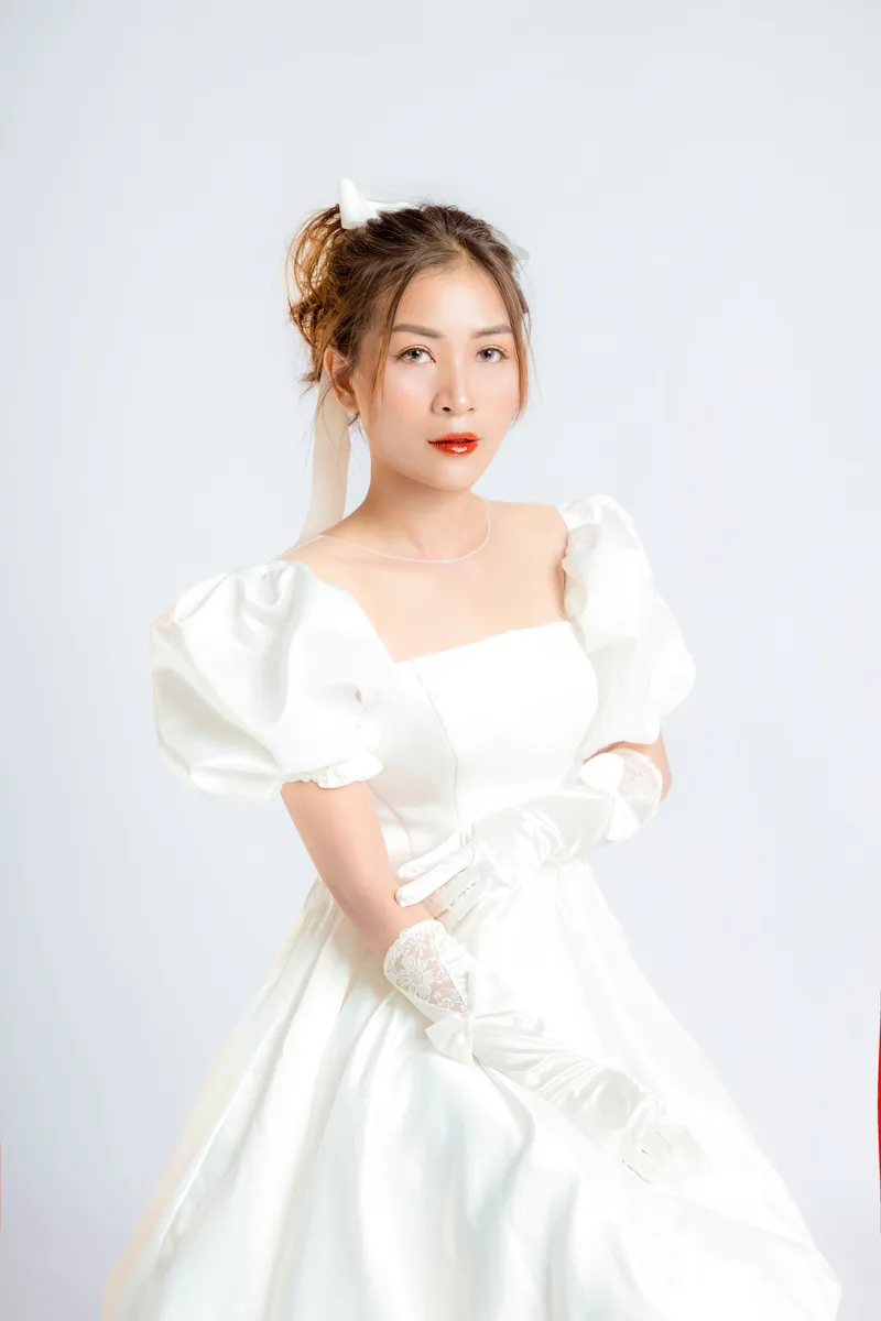 Satin gown with gathered puff sleeves and a square neckline