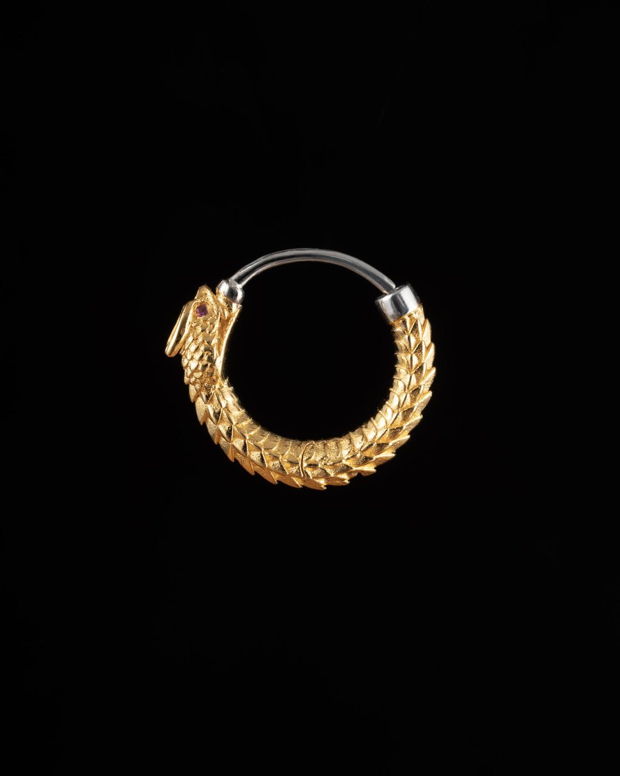 Textured gold hoop earring on black