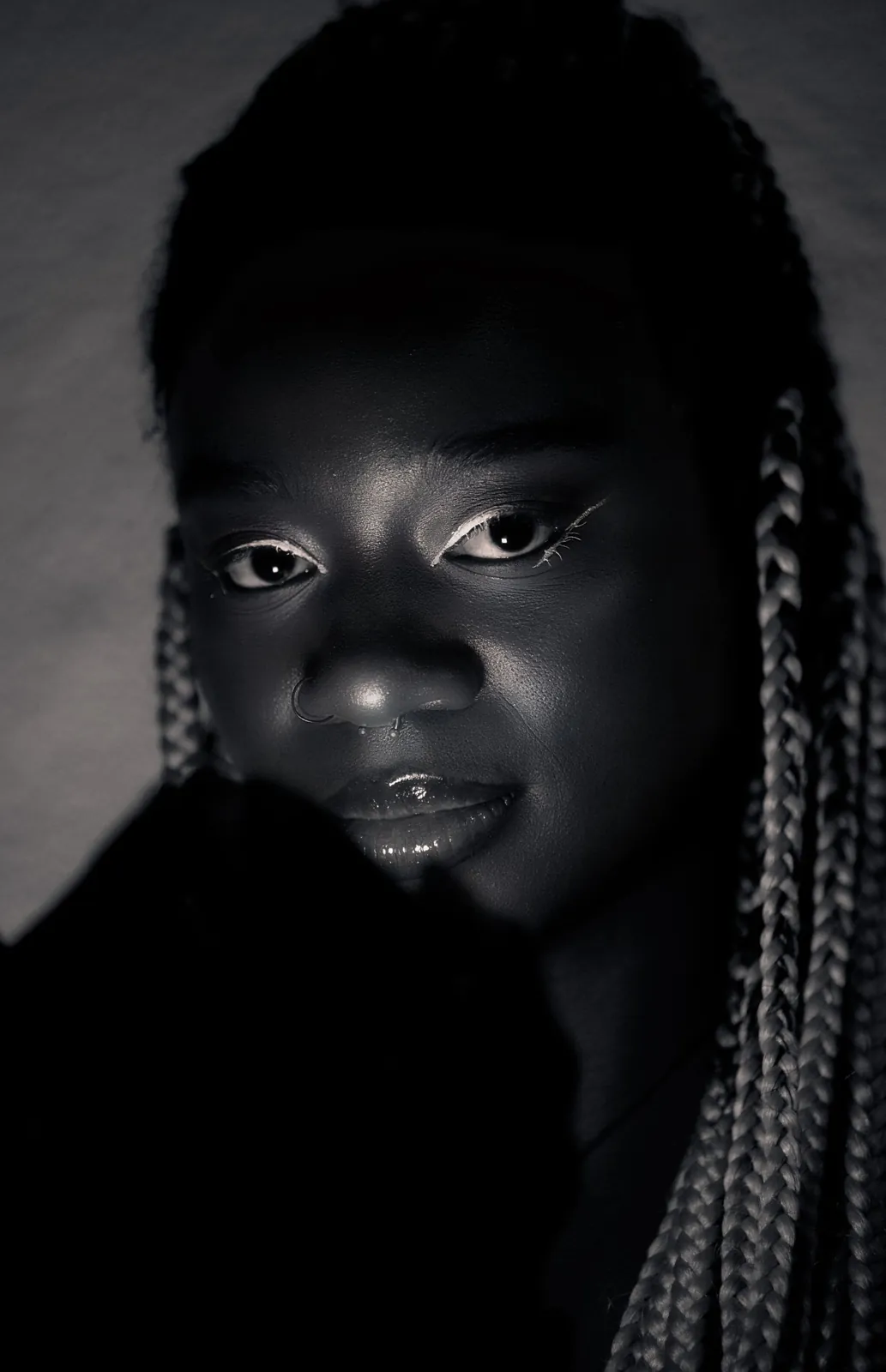 Low key portrait with light on the face