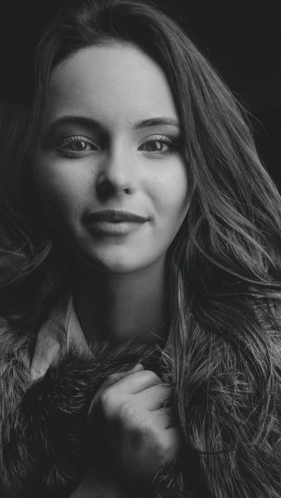Black and white portrait of a smiling woman
