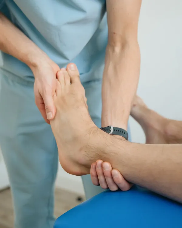 Therapist treating a patient's ankle