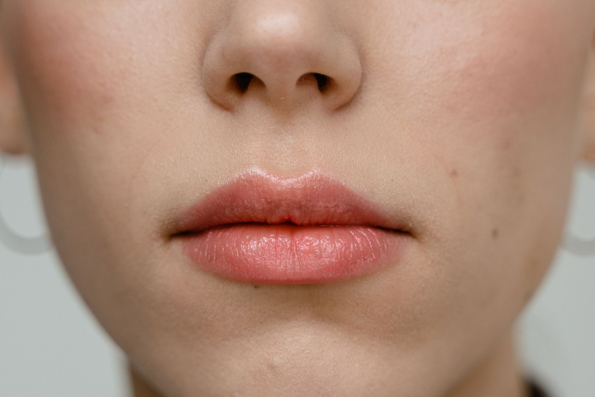 Lips with an even, soft peach tint