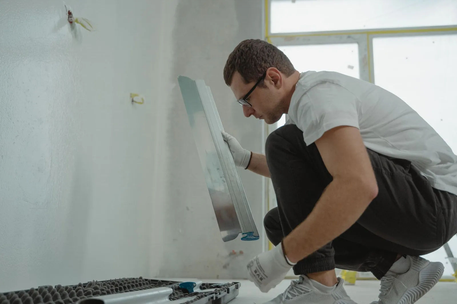 A Brandt crew member finishing a wall